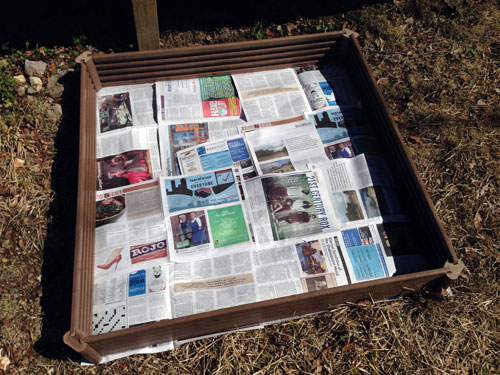 garden box with newspapers